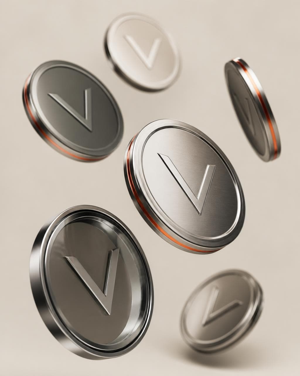 VamosCoins: discos metálicos con la marca V en perspectiva